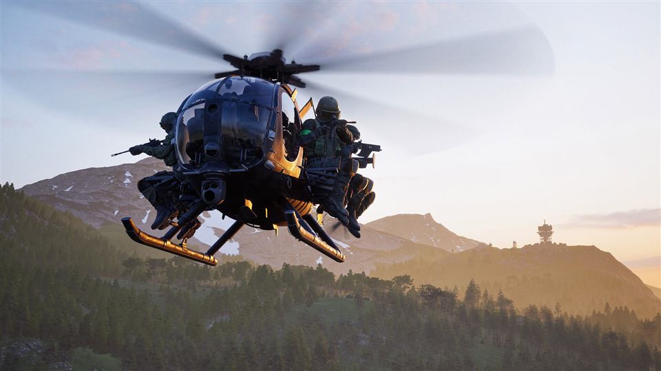 A helicopter carrying soldiers over mountains