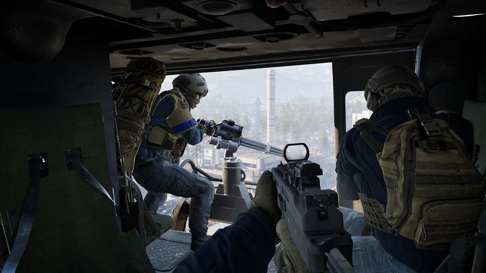 A squad riding in a helicopter